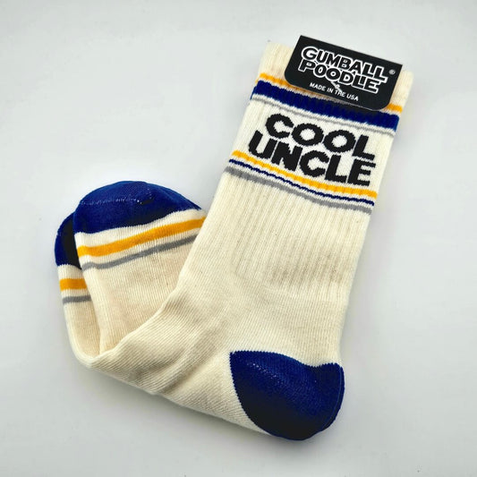 Beige socks with blue heels and toes, yellow and gray stripes with text, "COOL UNCLE."