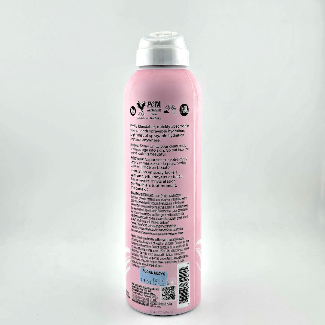 Pink spray bottle with a silver nozzle on a white background