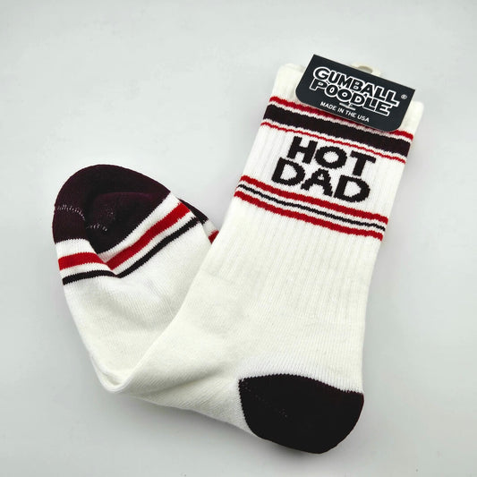 White socks with black toes and heels, with red and black stripes with text, "HOT DAD."