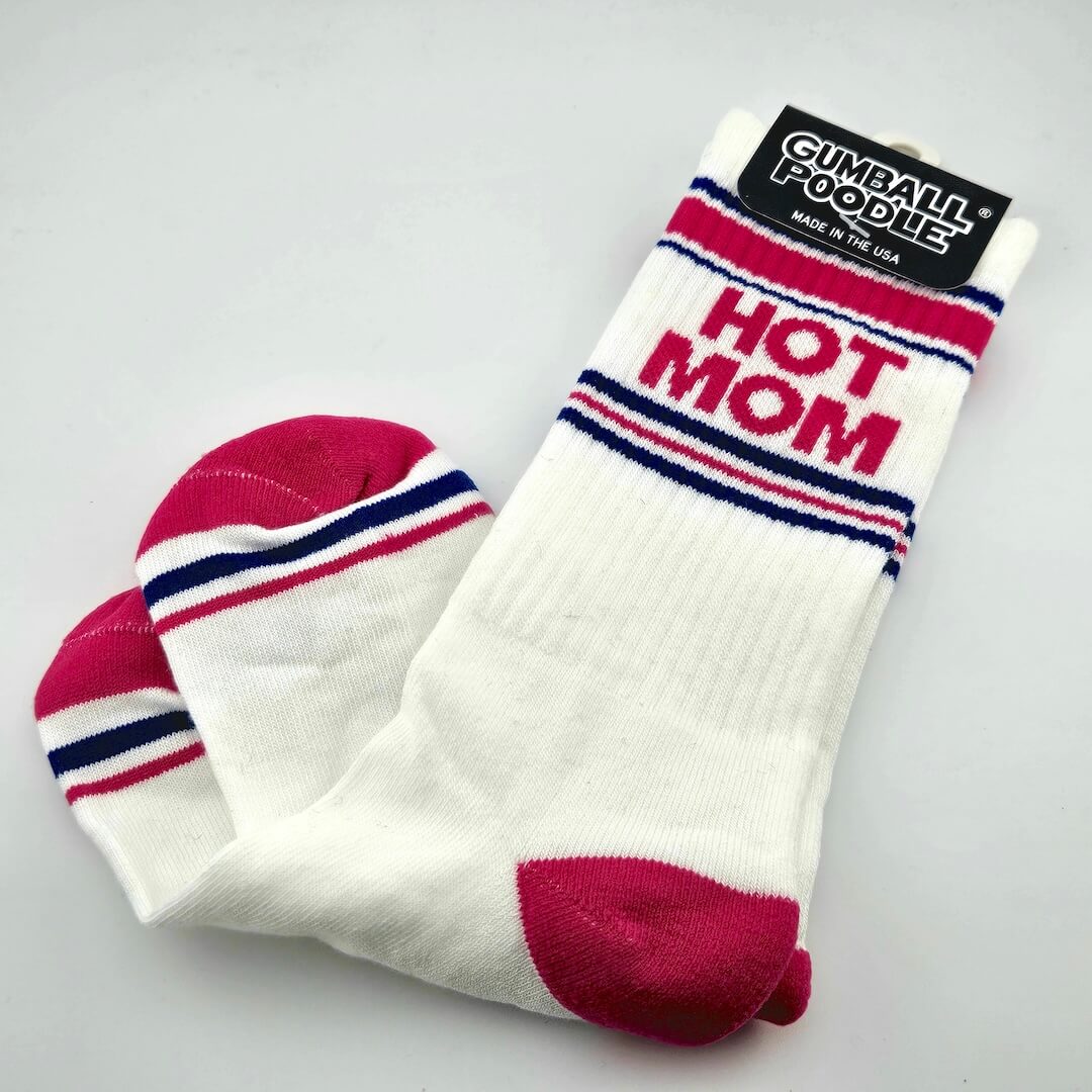 White socks with hot pink toes and heels, with navy and pink stripes, with text, "HOT MOM."
