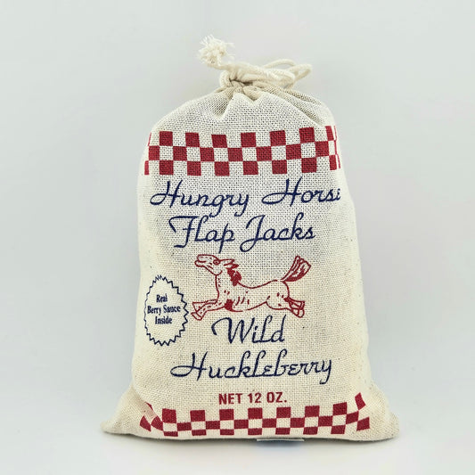 Fabric bag with 'Hungry Horse Flap Jacks' text and checkered design on a white background