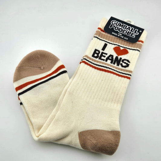 Beige socks with tan toes and heels with dark orange and tan stripes with text, "I [heart symbol] beans."