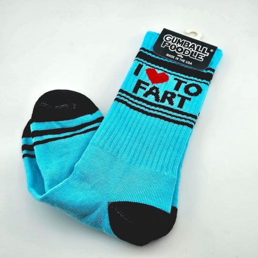 Cyan blue socks with black toes, heels, stripes, and text "I [heart symbol] to Fart." 