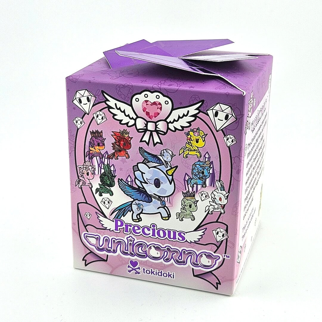 Purple packaging box with tokidoki 'Precious Unicorno' design on a white background