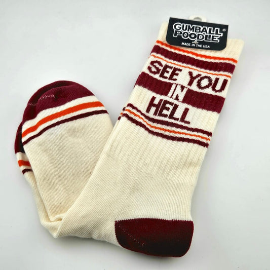Beige socks with maroon toes, heel, stripes, and text, "SEE YOU IN HELL."