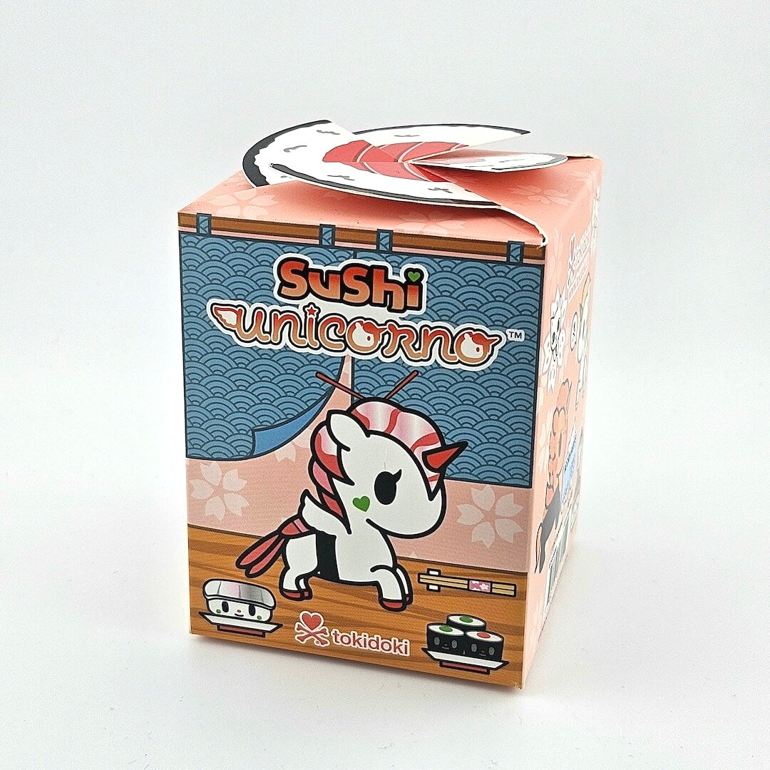 Sushi unicorn toy packaging with tokidoki branding on a light gray background