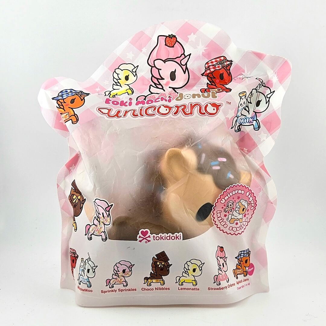 tokidoki unicoorn toy in packaging with character illustrations on a white background